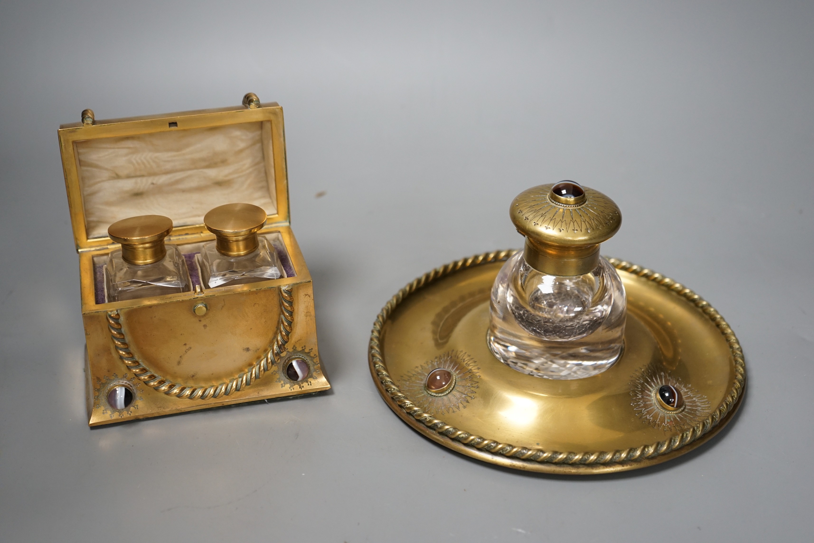 A Victorian agate mounted brass scent bottle casket and similar circular chest inkstand with knotted ribbon relief, 12cm wide